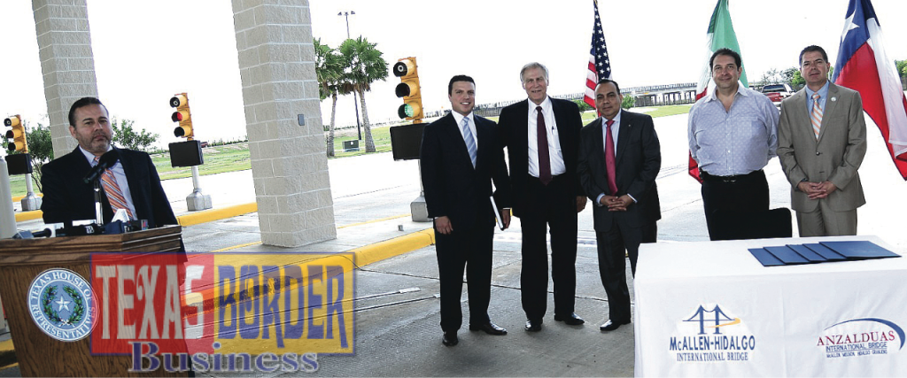 At the podium, Rigo Villareal, Superintendent of Bridges made the formal announcement of leaders and dignitaries. Standing in the back L-R: Sergio Muñoz Jr., Texas State Representative; Keith Patridge, President McAllen Economic Development Corp.: Ruben Plata, Commissioner city of Mission; Joaquin Spamer, President of CI Logistics Group; and Martin Garza, Manager city of Mission.