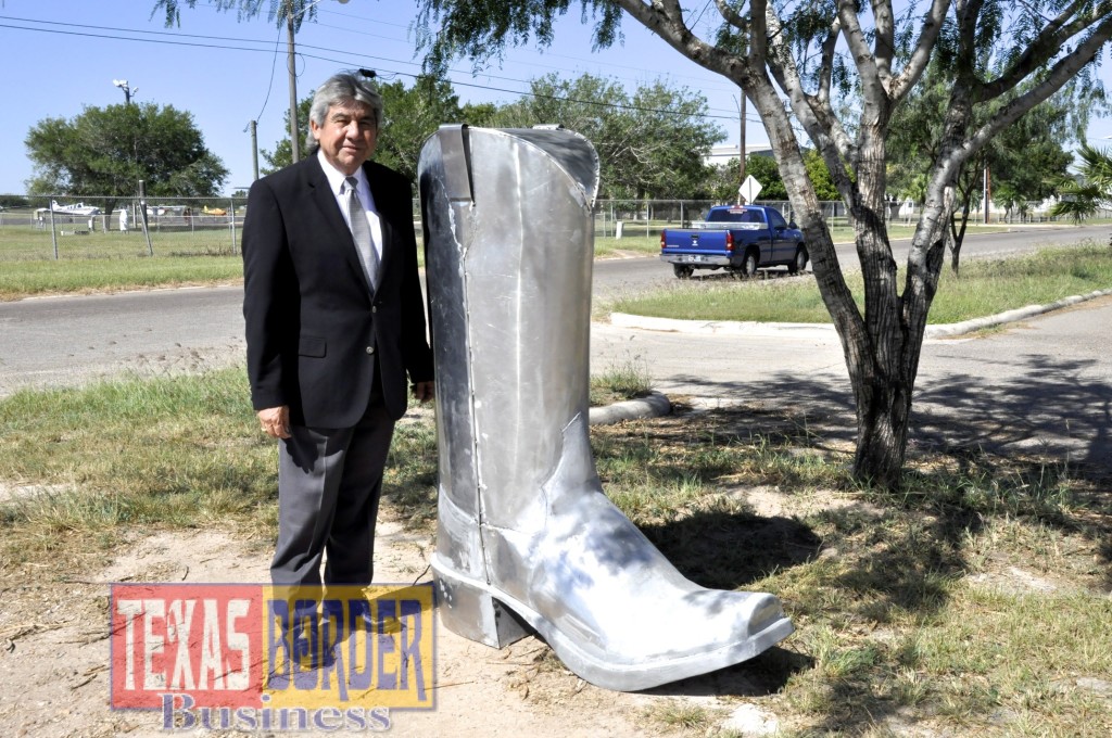 Hernan Gonzalez director of the Development Corporation of Mercedes next to the unfinished aluminum boot. The boot will be painted according to the colors of the college and their logo will also be placed on both sides of the boot. There will be 25 boots along the commercial corridor of Mercedes Texas.  Photo by Sal Hinojosa
