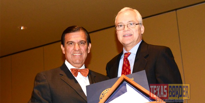 Senator Eddie Lucio, Jr. presents Byron Jay Lewis, Chairman of the Board and C.E.O. of Edwards Abstract and Title Co. with the Texas flag flown over the capital of Texas in Austin. Photo by Roberto Hugo Gonzalez