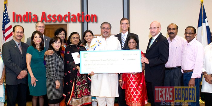 Pictured above holding the check from Right to Left: UT Pan American President Robert S. Nelsen; in the center in red Dr. Sarojini Bose and Hari Namboodiri, India Association of RGV president. TBB 