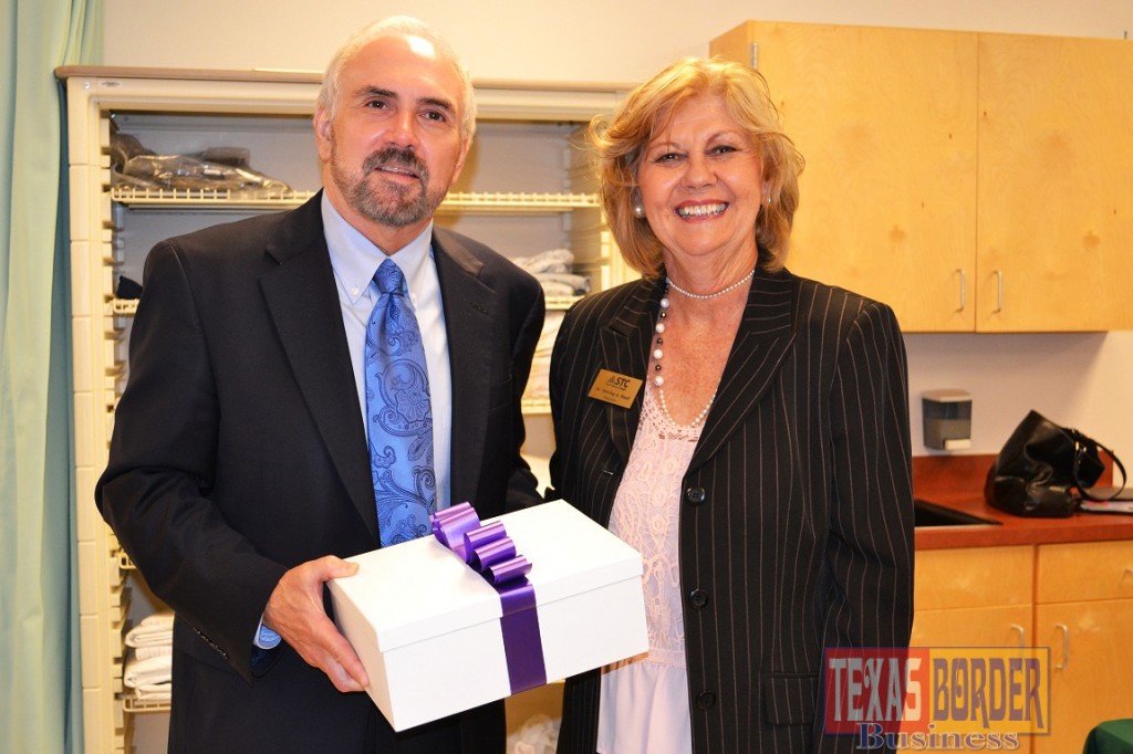 STC President Dr. Shirley A. Reed presents UTRGV President Dr. Guy Bailey with a gift to welcome him to the STC Nursing & Allied Health Campus in McAllen.