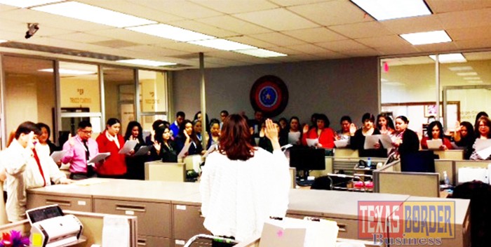 Pictured in the photo is Laura Hinojosa administering oath of office to staff/deputy district clerks