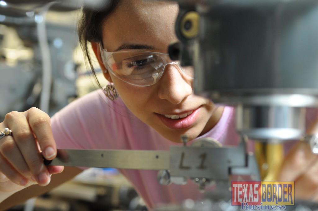 A South Texas College student closely examines her work while in the Precision Manufacturing Lab.