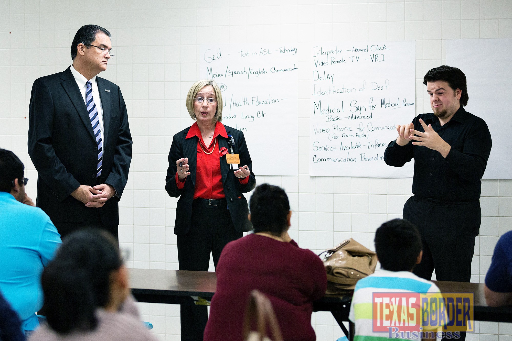 Dr. Shawn Saladin, Associate Professor in the School of Rehabilitation Services and Counseling, Linda Nelson, senior director of Clinical Operations, along with an interpreter, hosts a Town Hall Meeting for the Deaf and Hard of Hearing on Tuesday, Dec. 1, 2015 at Escandon Elementary School in McAllen, Texas.  UTRGV photo by Paul Chouy