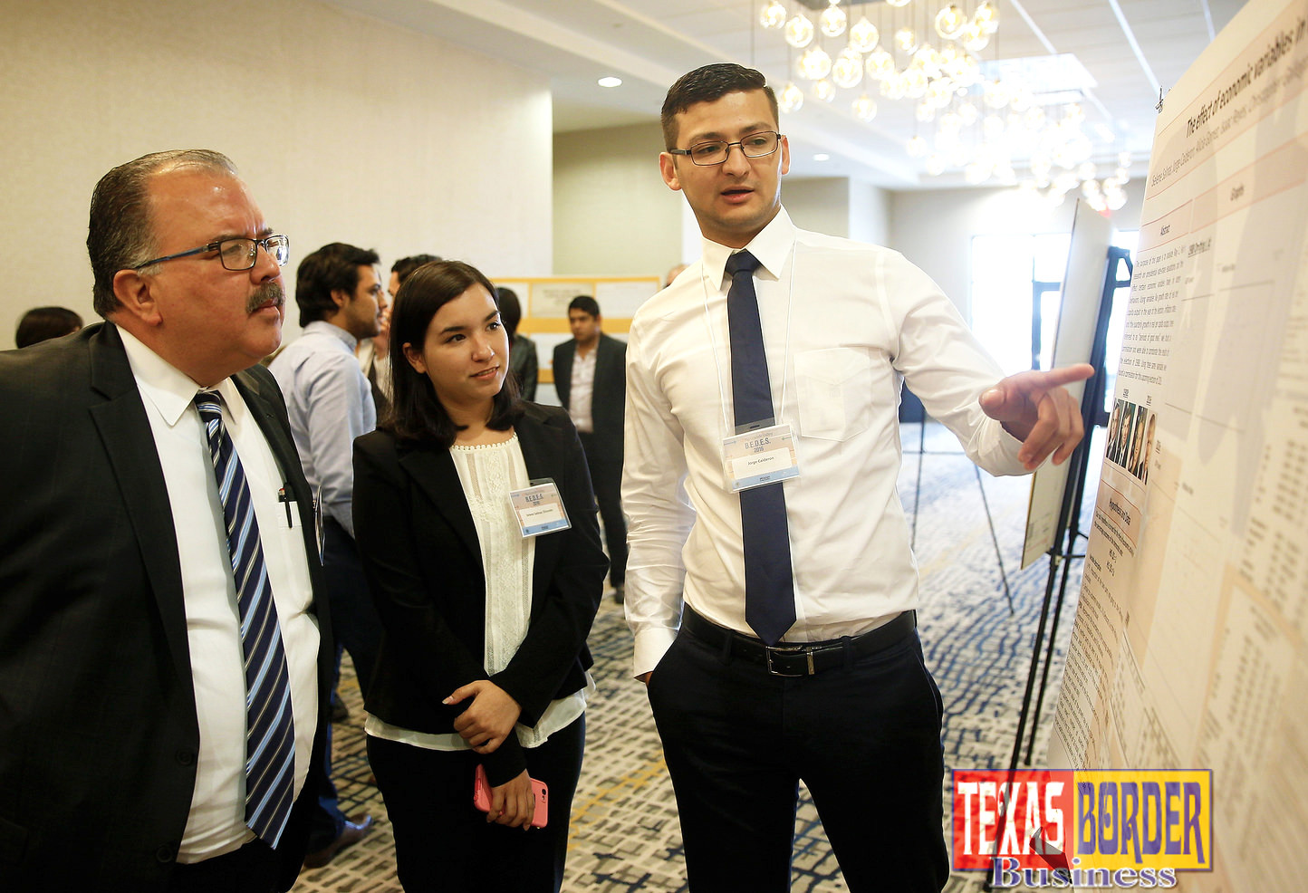 UTRGV students Selene Salinas and Jorge Calderon present their research on the effect of economic variables in voting behaviors, during the Border Economic Development & Entrepreneurship Symposium (BEDES) on Wednesday, Nov. 9, 2016, at the Embassy Suites McAllen Convention Center. The symposium was organized by the UTRGV Robert C. Vackar College of Business & Entrepreneurship, the Federal Reserve Bank of Dallas and the McAllen Chamber of Commerce. (UTRGV Photo by Paul Chouy)
