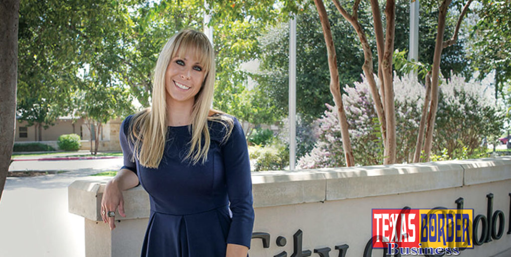 Lisa Gonzalez, posing by marquee sign of the City of Cibolo; a City that is experimenting a demographic explosion.