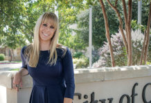 Lisa Gonzalez, posing by marquee sign of the City of Cibolo; a City that is experimenting a demographic explosion.