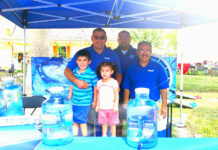 From left to right: Local residents Eloy Cuevas (with his children, Sarah and Alexander Cuevas), RGV marketing manager for Watermill Express, Rafael Salas, volunteer, and Rick Hibarguen, promotional specialist for Watermill Express, donated 150 gallons of water and 400 lbs. of ice to the Harlingen's Ales & Tails event on March 18, 2017.