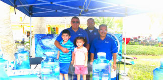From left to right: Local residents Eloy Cuevas (with his children, Sarah and Alexander Cuevas), RGV marketing manager for Watermill Express, Rafael Salas, volunteer, and Rick Hibarguen, promotional specialist for Watermill Express, donated 150 gallons of water and 400 lbs. of ice to the Harlingen's Ales & Tails event on March 18, 2017.
