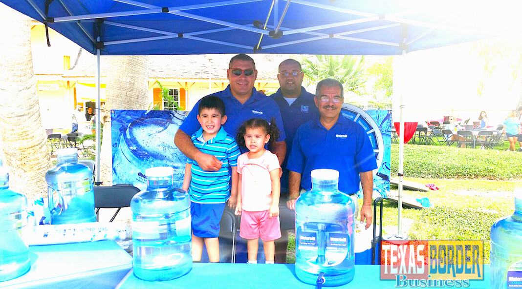 From left to right: Local residents Eloy Cuevas (with his children, Sarah and Alexander Cuevas), RGV marketing manager for Watermill Express, Rafael Salas, volunteer, and Rick Hibarguen, promotional specialist for Watermill Express, donated 150 gallons of water and 400 lbs. of ice to the Harlingen's Ales & Tails event on March 18, 2017.