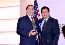 Congressman Henry Cuellar poses with Spirit of Enterprise Award with John Gonzalez, U.S. Chamber of Commerce Director for Congressional and Public Affairs, Southwest/South Central Region.