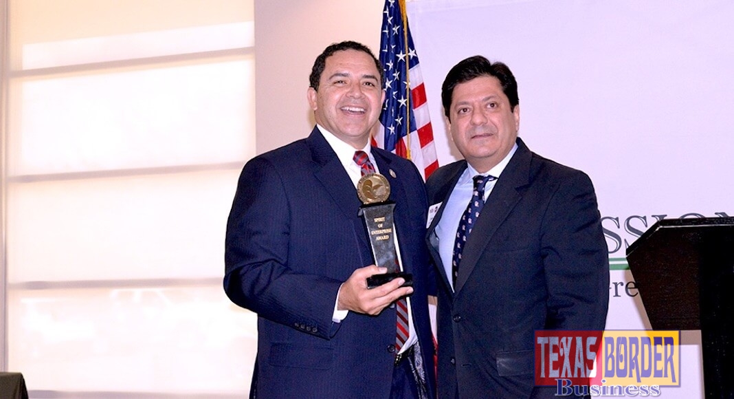 Congressman Henry Cuellar poses with Spirit of Enterprise Award with John Gonzalez, U.S. Chamber of Commerce Director for Congressional and Public Affairs, Southwest/South Central Region.