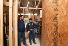 STC HVAC&R instructor Arturo Zamarripa (far left) inspects work being completed by students at a job site in east Edinburg Monday, Sept. 11. Participating in Habitat for Humanity's Builders Blitz event, students with with STC's College Construction Supervision Program, along with its Electrician Program as well as HVAC&R receive hands-on experience while becoming close with the people they serve.