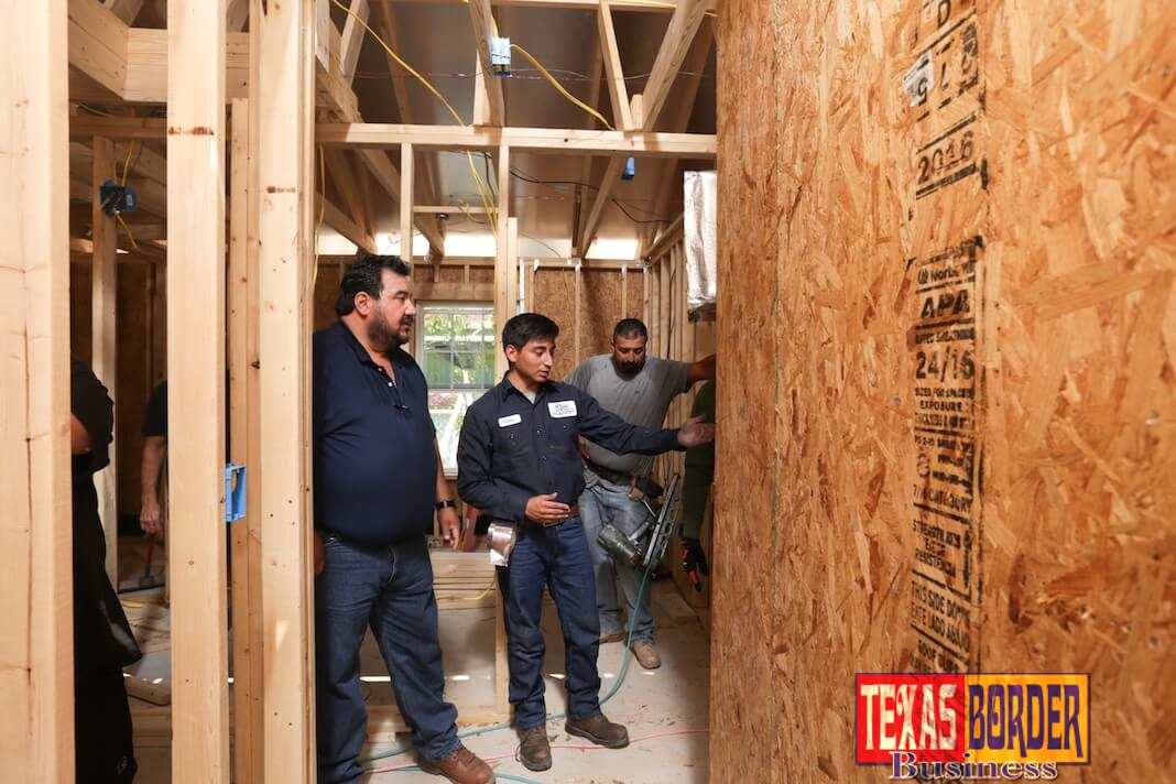 STC HVAC&R instructor Arturo Zamarripa (far left) inspects work being completed by students at a job site in east Edinburg Monday, Sept. 11. Participating in Habitat for Humanity's Builders Blitz event, students with with STC's College Construction Supervision Program, along with its Electrician Program as well as HVAC&R receive hands-on experience while becoming close with the people they serve.