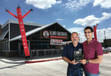 Photo above, the front entrance decorated for the grand opening of the new restaurant. Also, pictured is Abdul Hamideh to the right with a Slim Chicken’s Corporate Representative. Slim Chickens Franchisee Abdul and his father (not in the picture) recently opened their third Slim Chickens location in the Valley. Their commitment to the brand and community is showcased as their opening stayed on schedule the week after Hurricane Harvey.