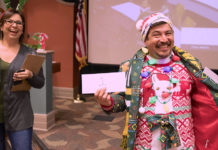 The UTRGV School of Medicine held its annual Ugly Sweater Contest, pitting faculty and staff from the Harlingen and Edinburg campuses against each other for the right to brag about having the ugliest holiday sweater, hands down. The SOM also collected gifts for families they are sponsoring in the Indian Hills neighborhood near Mercedes. Here, sweater contest champion Vicente Reyna proudly struts his stuff as the overall contest winner, to the amusement of Nina Jimenez, from the Graduate Medical Education department. (UTRGV Photo by David Pike)