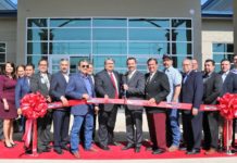 Pharr Mayor Ambrosio Hernandez, M.D., Pharr City Commissioners and EDC Board, EDA Regional Director Jorge Ayala, State Senator Eddie Lucio, State Representative Sergio Munoz, Jr., and other guests at a ribbon cutting ceremony for the new South Pharr Development and Research Center.