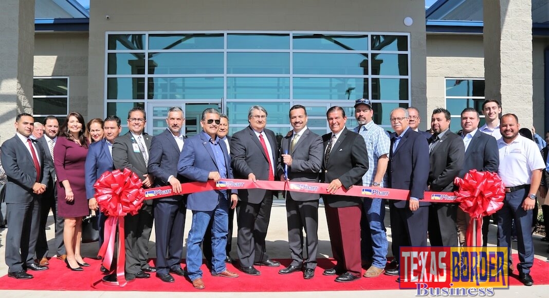 Pharr Mayor Ambrosio Hernandez, M.D., Pharr City Commissioners and EDC Board, EDA Regional Director Jorge Ayala, State Senator Eddie Lucio, State Representative Sergio Munoz, Jr., and other guests at a ribbon cutting ceremony for the new South Pharr Development and Research Center.