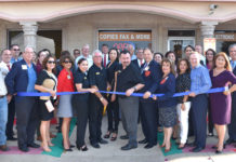 McAllen Chamber of Commerce cuts the ribbon at Advertir’s 40th anniversary reception. In the center in black polos are the staff, from left Vanessa Robledo, office manager, Christopher Julian, President, Gladys Rodriguez, sales assistant & Ralph De Anda, V.P