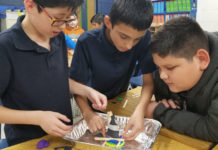 Middle Schoolers uses engineering skills to build a hurricane shelter.