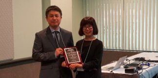 Dr. Myoung-Hwan Kim, UTRGV assistant professor of physics, was named Outstanding Young Researcher for 2018 by The Association of Korean Physicists in America, at the annual meeting of the American Physical Society. Here, he is seen accepting his award from AKPA President Young-Kee Kim at the KPS-AKPA Symposium in March at the Los Angeles Convention Center. (Courtesy Photo)