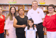 Monte Cristo Elementary School student Crystal Pacheco displays her Student Heroes Award during a special ceremony in the school’s library. Pictured (L-R): Ruth Espiricueta, Monte Cristo ES teacher, Marisa Perez-Diaz, member of the State Board of Education, District 3; Maria Cortez, Crystal’s mother; Crystal Pacheco, first-grade student; Dr. René Gutiérrez, Edinburg CISD superintendent; and Diana Cervantes-Smith, Monte Cristo ES principal.