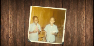 Picture of Two young African American boys receive Christmas gifts from the Boys Clubs of Edinburg, Inc in 1971.