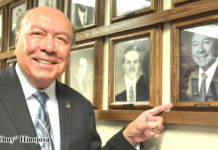 Sen. Juan "Chuy" Hinojosa admires his portrait on the Wall of County Judges.