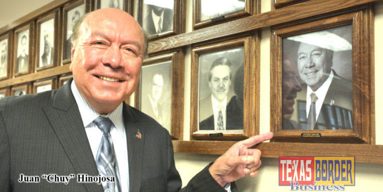 Sen. Juan "Chuy" Hinojosa admires his portrait on the Wall of County Judges.