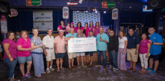 Pictured Above: DHR Health presents the Hope Family Health Center with a check for $300,000 at the 12th Annual “Fishing for Hope” Tournament in 2017.