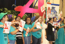 Edinburg CISD students proudly display “A” rating signs during the district’s General Assembly at the McAllen Convention Center.
