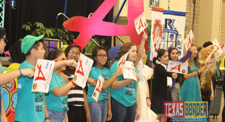 Edinburg CISD students proudly display “A” rating signs during the district’s General Assembly at the McAllen Convention Center.