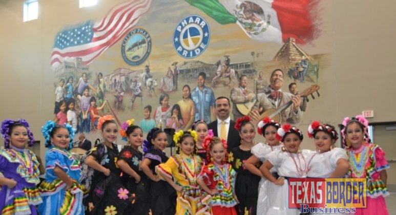 Pictured in the center is Mayor Ambrosio Hernandez, M.D. with members of the Folklorico group from Garcia Elementary at PSJA ISD, who entertained the audience at the start of the ceremony.