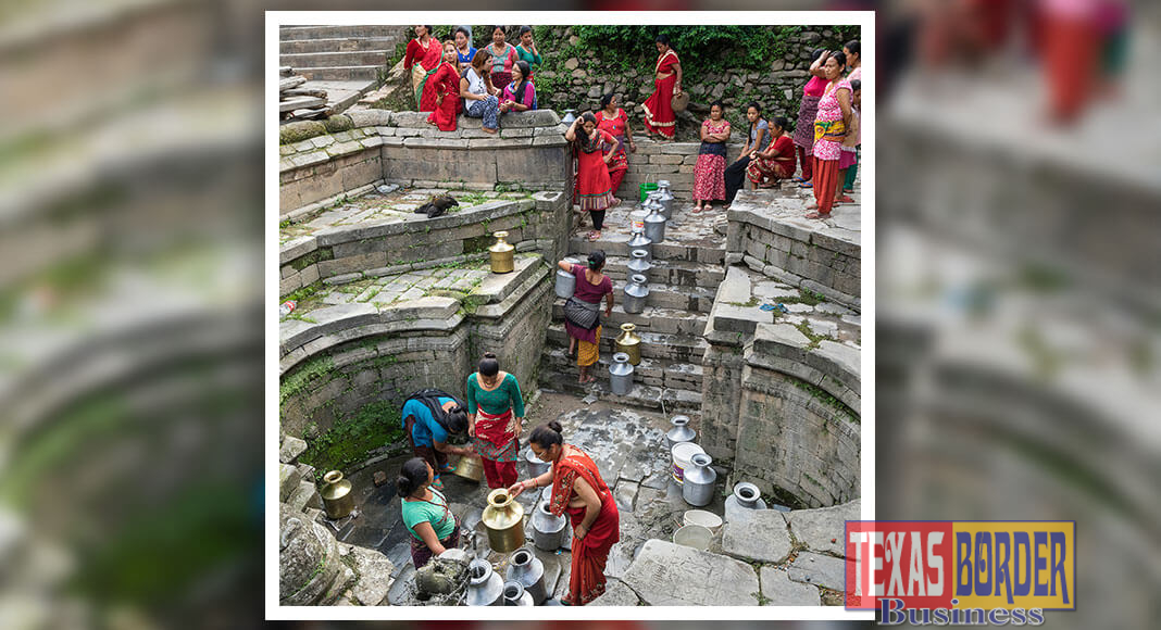 World-renowned photographers Martin Schoeller, Kristen Ashburn and Robert Clark selected photos for the exhibit.   Image Credit: Joe BN Leung, Queuing for Water, Photo on Aluminum