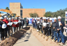 Commissioners Court, elected officials, and Hidalgo County department heads raise a shovel to commemorate the 2018 groundbreaking for the new courthouse.