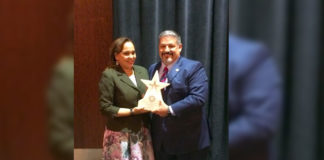 Assistant District Attorney Michael J. Garza (right) receives Lone Star Prosecutor of the Year award at the Texas District and County Attorneys Association Civil Law Update.