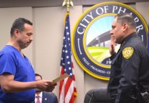 Mayor Ambrosio Hernandez administers the oath of office to Pharr's new Chief of Police, Jose Luengo.