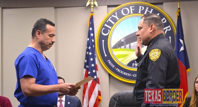 Mayor Ambrosio Hernandez administers the oath of office to Pharr's new Chief of Police, Jose Luengo.