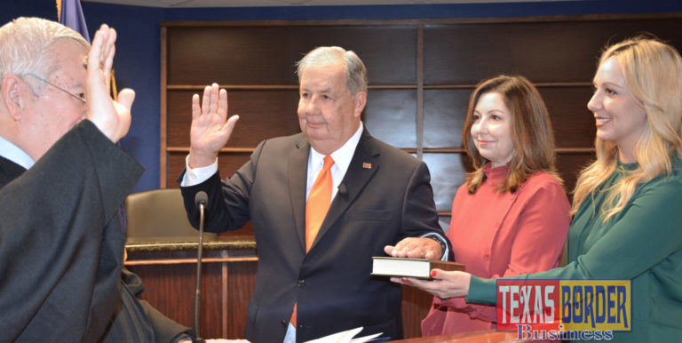 Former McAllen Mayor Richard Cortez as he took the oath of office and his daughters, Sandy Chandrahasan and Laura Mangelschots witnessed the oath administered by District Judge Israel Ramon.