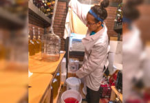 UTRGV is taking steps to catapult the Rio Grande Valley into a wine-making destination in Texas. Because South Texas struggles to grow the grapes most commonly used in wine production due to area plant diseases, George Bennack, UTRGV co-director of SARA (Center for Sustainable Agriculture and Rural Advancement) is researching grape strains that might thrive. Here, Ana Bennack, who helps her father with his research, tests a batch of wine. (UTRGV Photo by David Pike)