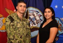 Navy Counselor 1st Class Ivan Aguilar of Pharr, Texas, poses for a photo with his sister, Lesley Torres of Edinburg, Texas.