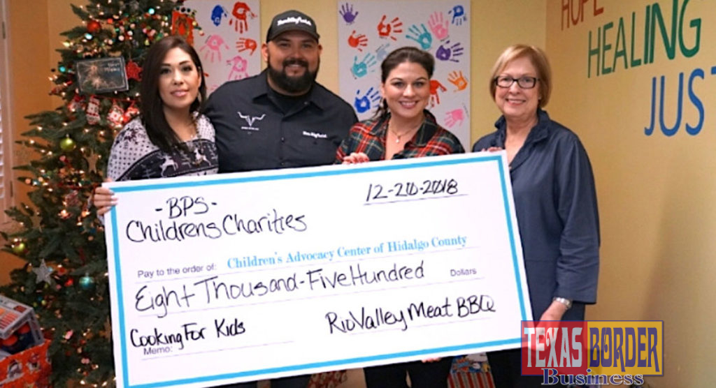 Yadi Robles, Fred Robles presenting check to Children's Advocacy Center Development Directors Tracy Gerdes and Pat Blum.