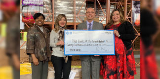 “BCBS FEED CHILDREN” Blue Cross Blue Shield presenting check to Jackie Flores, FBRGV and Ron Meijerink, CEO, FBRGV. Photo credit: Food Bank RGV.