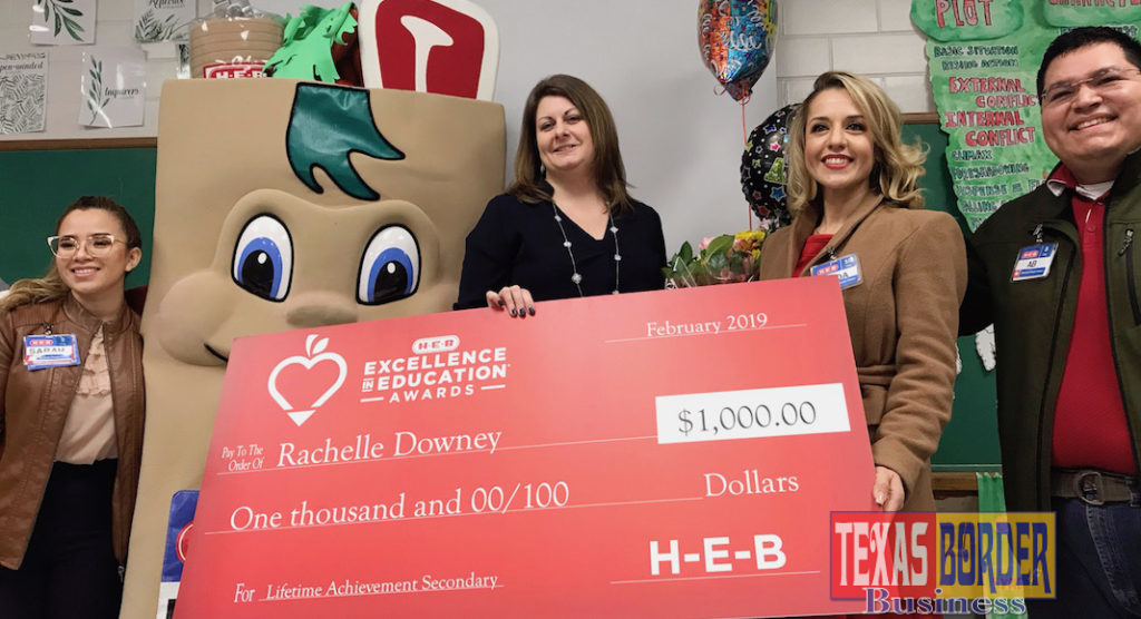 H-E-B representatives had balloons, flowers and a check for $1,000 for Ms. Downey. Her school also received $1,000. 