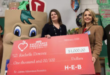H-E-B representatives had balloons, flowers and a check for $1,000 for Ms. Downey. Her school also received $1,000.