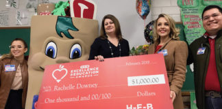 H-E-B representatives had balloons, flowers and a check for $1,000 for Ms. Downey. Her school also received $1,000.