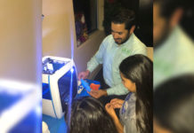 Abraham Quiroga, Business & Employee Development Division Manager for Magic Valley Electric Cooperative (MVEC) demonstrates how a 3D printer works with Boys & Girls Clubs of Edinburg RGV’s Club members.