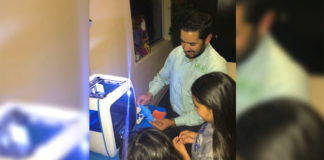 Abraham Quiroga, Business & Employee Development Division Manager for Magic Valley Electric Cooperative (MVEC) demonstrates how a 3D printer works with Boys & Girls Clubs of Edinburg RGV’s Club members.