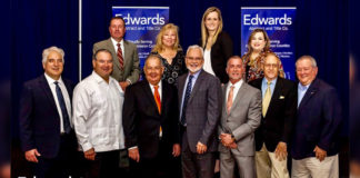 Edwards Abstract and Title Co. Members of Management and the Executive Team gather with guests after the 15th Annual State of Real Estate Forum held on March 8th. Congratulations to the guest speakers Dr. Ted C. Jones and Hidalgo County Judge Richard Cortez for their informative presentations. Thank you to over 300 guests who attended. Pictured are (first row l-r) Mark Pena, Lewis Monroe & Pena; Hidalgo County Clerk Arturo Guajardo; Hidalgo County Judge Richard Cortez; Byron Jay Lewis, Edwards Abstract and Title Co. President & CEO; N. Michael Overly, Edwards Abstract and Title Co. Executive Vice President/CFO & COO; Guy S. Huddleston, III, Edwards Abstract and Title Co. Senior Vice President/Customer Development; D.D. Hoffman, Edwards Abstract and Title Co. Sr. Vice President/Corporate Ambassador. Second row (l-r) Mike Watson, Stewart Title Guaranty Co.; Elva Jackson Garza, Edwards Abstract and Title Co. Vice President & Marketing Manager; Tara Smith, Stewart Title Guaranty Co. and Marilyn De Luna, Vice President of Education & Training/Commercial Escrow Officer.