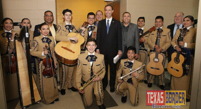 Texas Secretary of State David Whitley (center) distributes voter registration cards to Edinburg North High School students at the performing arts center. Pictured (L-R): Members of the Edinburg North High School Mariachi Oro, ECISD School Board President Robert Peña Jr., ECISD School Board Member Miguel “Mike” Farias, Secretary Whitley, ECISD Superintendent Dr. René Gutiérrez and Edinburg North High School Principal Mark Micallef.